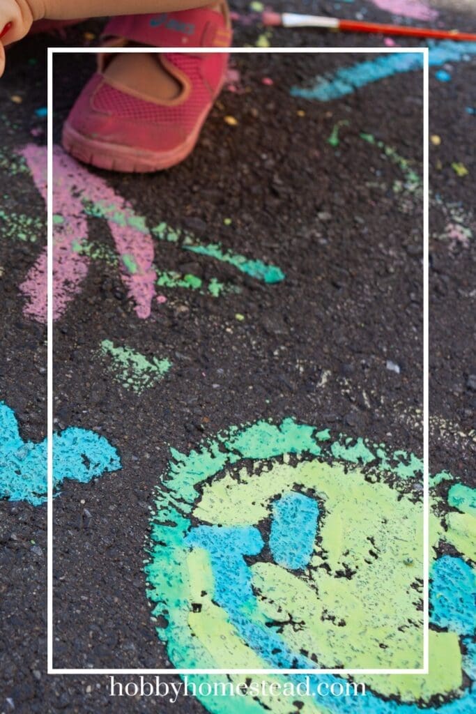 Child using Homemade Chalk Paint